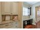 Laundry room with built-in desk and extra storage at 2005 Heathermere Way, Roswell, GA 30075