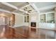 Spacious living room features hardwood floors, built-in shelving, and a fireplace at 2005 Heathermere Way, Roswell, GA 30075