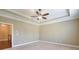 Spacious main bedroom with hardwood floors and a ceiling fan at 2005 Heathermere Way, Roswell, GA 30075