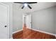 Simple bedroom with hardwood floors, ceiling fan, and neutral walls at 871 Harwell Nw Rd, Atlanta, GA 30318