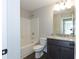 Bathroom with tub, shower and granite vanity at 130 Eryn Ter, Covington, GA 30014