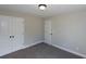 Bedroom with double door closet and carpet at 130 Eryn Ter, Covington, GA 30014