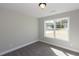 Bedroom with window and grey carpet at 130 Eryn Ter, Covington, GA 30014