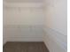 Walk-in closet with wire shelving at 130 Eryn Ter, Covington, GA 30014