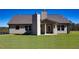 Rear view of the house showing patio and yard at 130 Eryn Ter, Covington, GA 30014