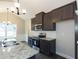 Modern kitchen with granite countertops and stainless steel appliances at 130 Eryn Ter, Covington, GA 30014
