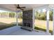 Covered patio with a stone fireplace and ceiling fan at 130 Eryn Ter, Covington, GA 30014
