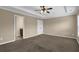 Bedroom with neutral walls, carpet, and an ensuite bathroom entrance at 2935 Maple Park Pl # 49, Cumming, GA 30041