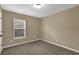 Bedroom features neutral walls and carpet, along with natural lighting at 2935 Maple Park Pl # 49, Cumming, GA 30041