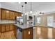 Open concept living area connects the kitchen, dining, and living spaces at 2935 Maple Park Pl # 49, Cumming, GA 30041