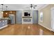 Open concept living room features fireplace, ceiling fan, and lots of natural light at 2935 Maple Park Pl # 49, Cumming, GA 30041