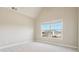 Bright room with neutral walls, plush carpet, and a window with lots of natural light at 328 Thistlewood Run, Mcdonough, GA 30252