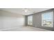 Carpeted bedroom with fan and two windows at 328 Thistlewood Run, Mcdonough, GA 30252