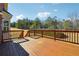 A spacious wooden deck offers outdoor enjoyment with backyard views and sunshine at 328 Thistlewood Run, Mcdonough, GA 30252