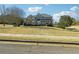 Two-story home with brick facade, a covered porch, and a large manicured front yard at 328 Thistlewood Run, Mcdonough, GA 30252