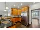 Well-appointed kitchen with granite counters, stainless steel appliances, and hardwood flooring at 328 Thistlewood Run, Mcdonough, GA 30252