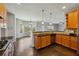 Spacious kitchen with stainless steel appliances, granite countertops, and hardwood flooring throughout at 328 Thistlewood Run, Mcdonough, GA 30252