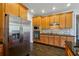 Modern kitchen with stainless steel appliances, granite countertops, and ample cabinet space at 328 Thistlewood Run, Mcdonough, GA 30252