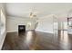 Inviting living room featuring hardwood floors, a cozy fireplace, and an open layout at 328 Thistlewood Run, Mcdonough, GA 30252