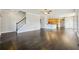 Expansive living area showcasing hardwood floors, a fireplace, and seamless flow to the kitchen at 328 Thistlewood Run, Mcdonough, GA 30252