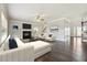 Bright living room featuring hardwood floors, fireplace, and neutral tones for relaxation and gatherings at 328 Thistlewood Run, Mcdonough, GA 30252