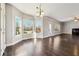 Spacious living room boasts hardwood floors and an abundance of natural light at 328 Thistlewood Run, Mcdonough, GA 30252
