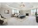 Spacious main bedroom with a trey ceiling, fireplace, and ample natural light at 328 Thistlewood Run, Mcdonough, GA 30252