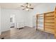 Bedroom featuring a ceiling fan, built-in bookshelves, and a dresser at 2025 Oakley Se Trce, Smyrna, GA 30080