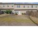 Backyard view showcasing a well-maintained lawn and exterior of the home at 2725 Morgan Glen Rd, Buford, GA 30519