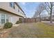 Backyard view showcasing a well-maintained lawn and exterior of the home at 2725 Morgan Glen Rd, Buford, GA 30519