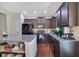 Spacious kitchen with dark cabinetry, modern appliances, and center island at 2725 Morgan Glen Rd, Buford, GA 30519