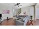 Bright living room with fireplace, wood floors, and a comfortable gray sectional sofa at 2725 Morgan Glen Rd, Buford, GA 30519