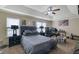 Spacious main bedroom with tray ceiling, ceiling fan, and ample natural light at 2725 Morgan Glen Rd, Buford, GA 30519