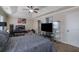 Inviting bedroom with tray ceiling, ceiling fan, and carpet floors at 2725 Morgan Glen Rd, Buford, GA 30519