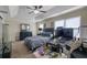 Comfortable bedroom with tray ceiling, fan, and windows at 2725 Morgan Glen Rd, Buford, GA 30519