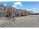 Charming street view of townhomes with garages, well-maintained landscaping, and inviting curb appeal at 2725 Morgan Glen Rd, Buford, GA 30519
