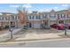 Attractive townhomes featuring attached garages, well-maintained landscaping, and welcoming front entrances at 2725 Morgan Glen Rd, Buford, GA 30519
