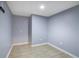 Empty basement room with tile floors and neutral walls at 1155 Carlysle Park Dr, Lawrenceville, GA 30044