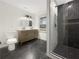 An elegant bathroom with a glass shower, double vanity, and modern fixtures at 2704 Ellen Way, Decatur, GA 30032
