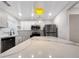 Bright kitchen with stainless steel appliances, marble countertops and modern lighting fixtures at 2704 Ellen Way, Decatur, GA 30032