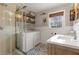 Laundry room with washer, dryer, and updated vanity at 3741 Hickory Se Cir, Smyrna, GA 30080