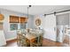 Bright dining area with farmhouse table and sliding barn door at 3741 Hickory Se Cir, Smyrna, GA 30080