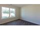 Bright bedroom with large window and neutral carpeting at 40 Eryn Ter, Covington, GA 30014