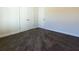 Spacious bedroom with double doors and wall-to-wall carpet at 40 Eryn Ter, Covington, GA 30014