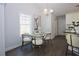 Bright dining area with modern chandelier and elegant chairs at 40 Eryn Ter, Covington, GA 30014