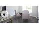 Bright dining room with glass-top table, upholstered chairs, and neutral carpet at 40 Eryn Ter, Covington, GA 30014
