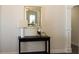 Elegant entryway with a console table and a decorative mirror at 40 Eryn Ter, Covington, GA 30014