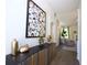 Hallway features modern artwork and decor with hardwood flooring and neutral color palette at 40 Eryn Ter, Covington, GA 30014