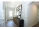 Hallway features modern decor and neutral color palette with hardwood flooring at 40 Eryn Ter, Covington, GA 30014