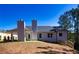Rear view of the house showcasing a patio and landscaped yard at 40 Eryn Ter, Covington, GA 30014